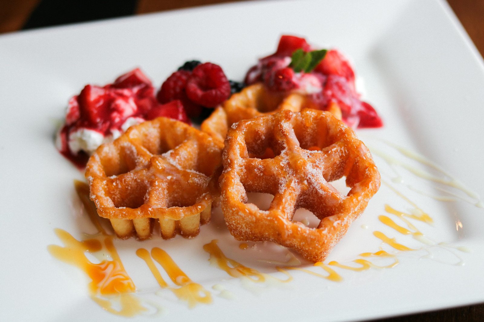 Buñuelos crispy fritters with caramel and berry sauce at Tequila Fuego Mexican restaurant