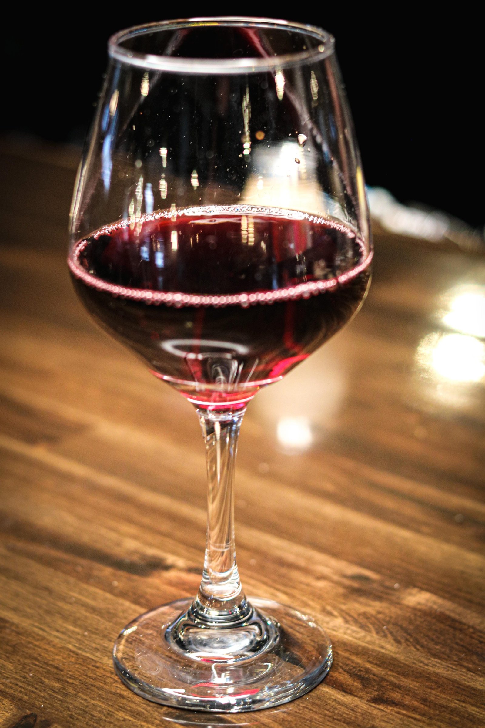 Glass of red wine at Tequila Fuego happy hour, Longview WA Mexican restaurant bar.