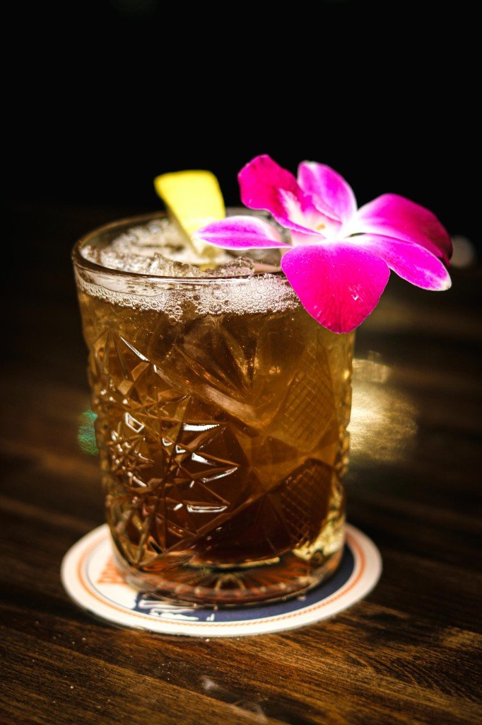 Craft cocktail with orchid and lemon at Tequila Fuego Longview WA